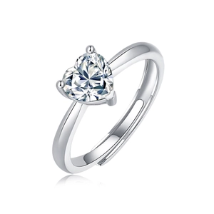 Macro shot of silver heart-shaped stone ring with adjustable open band and polished finish