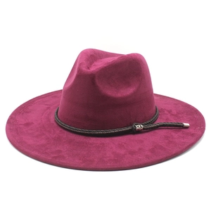 Detail of dark rose red suede fedora featuring a braided band and silver metal buckle
