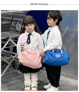 Kids sports barrel bag in pink and blue with adjustable straps and TOCHASO logo detail