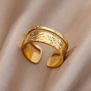18k gold plated stainless steel open ring with unique hammered texture on silk background