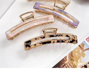 Three acetate hollow hair claws in purple gradient, pink marble and tortoiseshell patterns