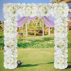 Detailed view of white artificial rose floral arrangement for outdoor wedding arches