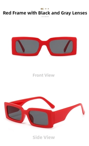 Detail view of bold red square sunglasses with thick frames and dark gray lenses