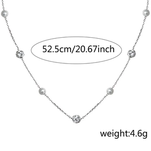 Elegant stainless steel Y-shaped necklace with white pearls and textured silver beads