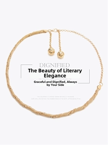 Detail of gold braided metal waist chain with elegant hollow ball charms and adjustable clasp