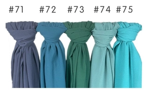 Vertical display of solid color pearl chiffon scarves showing fabric drape and five colors