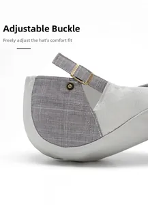 Close-up of adjustable metal buckle on gray textured newsboy cap for custom head fit