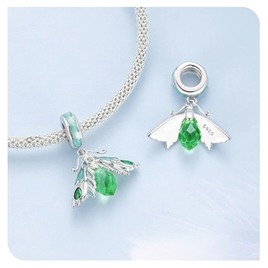 Detailed view of S925 sterling silver firefly charm with green crystal on woven bracelet