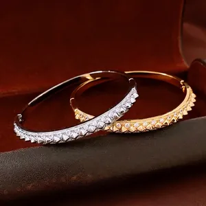 18K gold plated stud bracelets with zircon accents in gold and silver finish