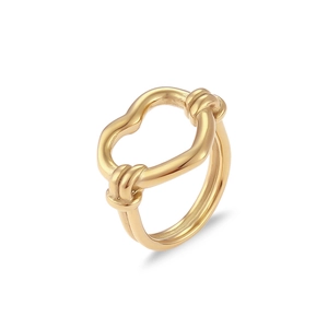 Detail shot of a golden stainless steel ring with a unique twisted hollow knot design