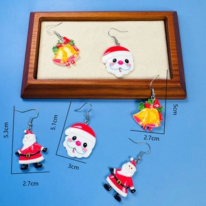 Detailed size chart of Christmas earrings featuring Santa and bells on blue background