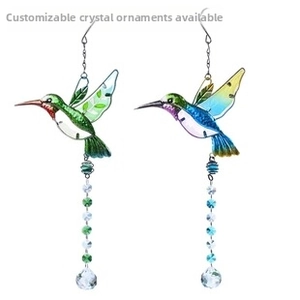 Detail of hummingbird suncatcher with crystal bead chain and transparent crystal ball drop