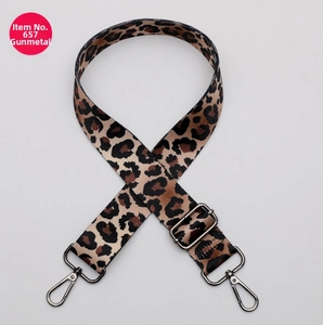 Detail of adjustable leopard print bag strap with gunmetal swivel hooks and buckle