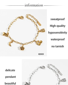 Detail view of waterproof stainless steel bracelet with cherry and heart charms