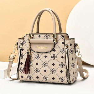 Beige large capacity faux leather handbag for women with monogram print and tassel detail