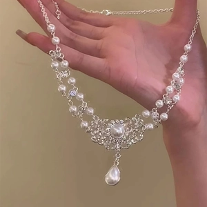 Baroque style pearl necklace with rhinestone waterdrop pendant and silver chain