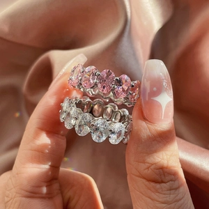 Detailed view of S925 silver eternity rings with pink and clear oval zirconia stones