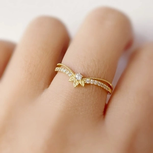 Elegant gold double-layered leaf ring with pavé diamonds for women in a minimalist style