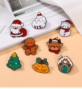 Collection of eight colorful Christmas enamel pins including Santa Claus and gingerbread man