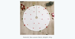 Détail du tapis de sapin de Noël blanc en intissé avec broderie rouge et pompons
