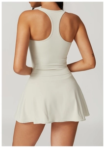 Detail view of racerback sports dress with pleated hem for tennis and workout