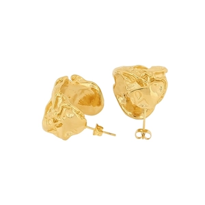Macro shot of gold irregular C-shape earrings with textured molten metal surface