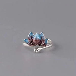 Macro detail of silver lotus ring with blue and red enamel finish and adjustable band