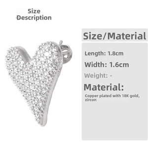 Detailed size view of heart earrings in 18K gold plated copper with zircon stones