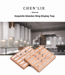 Dual wooden jewelry trays with beige velvet slots for ring and earring display