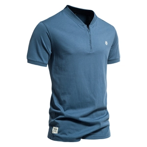 Detail of blue cotton V-neck shirt showing the zipper collar and quality knitting texture