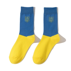 Close-up of blue and yellow Ukraine flag socks with embroidered national emblem detail