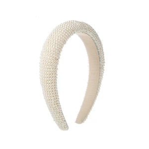 Detailed close-up of cream white sponge headband with densely packed pearls for women