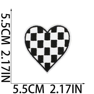 Close-up of black and white checkered heart embroidery patch with size dimensions