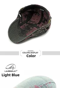 Detail of washed denim beret with vintage floral lining and adjustable bronze buckle