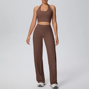 Detail of dark coffee yoga set with halter neck sports bra and wide-leg trousers