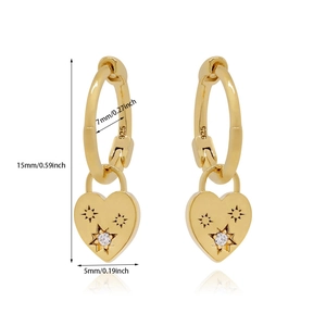 Macro shot of 24K gold plated heart earrings with zircon inlay and S925 hallmark