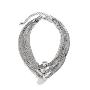 Detail of silver multi-layer chain necklace featuring three polished gradient beads