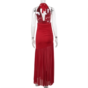 Detail of red backless maxi dress featuring mesh ruffled hem and elegant halter neckline