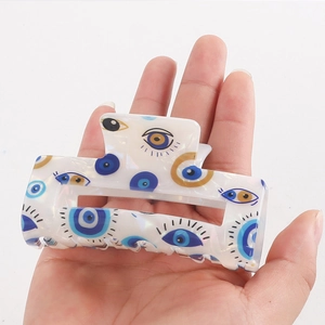 Pearlescent PVC hair claw clip with blue and gold Evil Eye patterns for women hair
