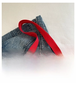 Detail of red oxford tote bag reinforced handles with romantic time letter print