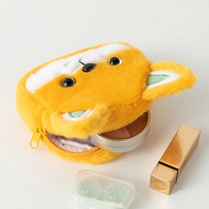 Detailed interior of plush shiba inu coin purse holding lipstick and compact powder