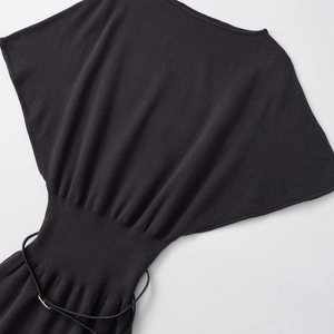 Elegant black knit midi dress with batwing sleeves and belted waist on white background
