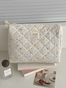Trousse à maquillage en velours côtelé matelassé avec motifs floraux jaunes