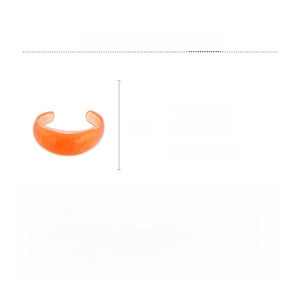 Detail view of an orange resin open bangle with amber texture and size dimensions