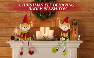 Detail of red and green Christmas elf plush toys with long legs on a festive mantelpiece