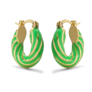Macro detail of twisted gold-plated hoop earrings with vibrant green enamel finish