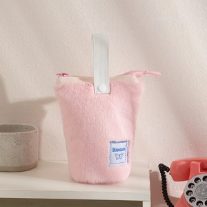 Detail of pink plush pencil case with white canvas handle and soft faux fur texture