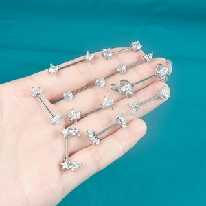Surgical steel nipple rings set with butterfly heart shapes and sparkling zircon gems