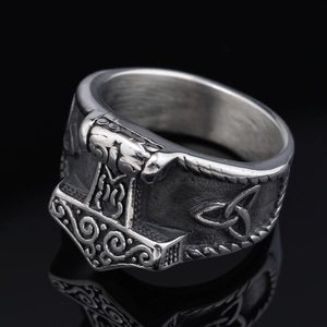 Vintage Thor's Hammer stainless steel ring with Celtic knot details on black background