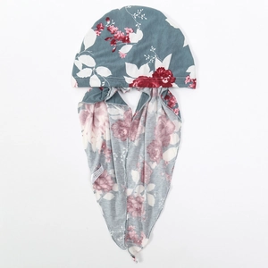 Close-up of 100% polyester fabric texture and floral pattern on a grey headscarf hat